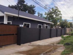 a black fence in front of a house at SIXTYSIXLUXE 3Br 2B in Penampang +3 photos