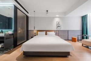 Letto o letti in una camera di Chenfeng Hotel Jingdezhen Taoyangli People's Square Branch