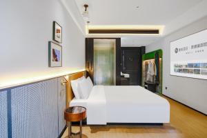 Letto o letti in una camera di Chenfeng Hotel Jingdezhen Taoyangli People's Square Branch