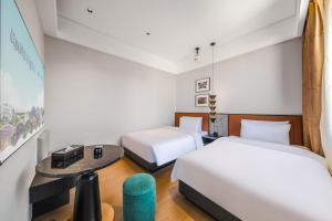 Letto o letti in una camera di Chenfeng Hotel Jingdezhen Taoyangli People's Square Branch