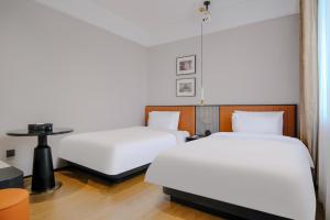 Letto o letti in una camera di Chenfeng Hotel Jingdezhen Taoyangli People's Square Branch