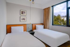 Letto o letti in una camera di Chenfeng Hotel Jingdezhen Taoyangli People's Square Branch