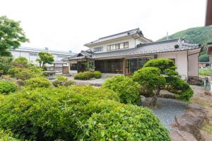 a house with a garden in front of it at GuestHouse道 in Fujiyoshida +34 photos
