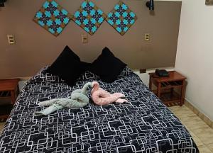 Ein Bett oder Betten in einem Zimmer der Unterkunft Hotel las Dunas