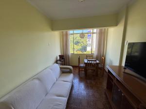 Et tv og/eller underholdning på Apartamento Vista da Praia Espetacular!