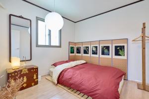 Postel nebo postele na pokoji v ubytování Only Suwon