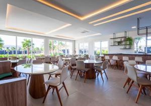 Restoran atau tempat lain untuk makan di Casa na praia em exclusivo Resort Particular