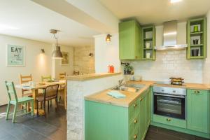 Kuchyňa alebo kuchynka v ubytovaní Villa Manus - Boutique Apartments