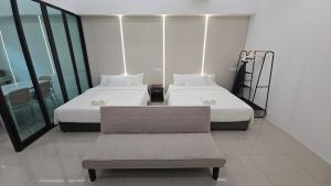 Ein Bett oder Betten in einem Zimmer der Unterkunft One Point Hotel TT3 Tabuan Tranquility
