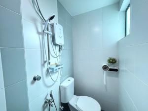 a bathroom with a shower with a toilet in it at Sky Garden Ipoh Comfortable Homestay 6-7pax SY27 in Chemor +23 photos