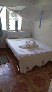 Postel nebo postele na pokoji v ubytování Emma's Homestay Explorer