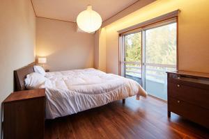 Giường trong phòng chung tại マイグレ600