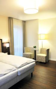 Postel nebo postele na pokoji v ubytování Hotel Drei Linden