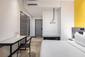 Postel nebo postele na pokoji v ubytování Amaris Hotel Lampung City