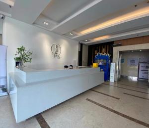Лобі або стійка реєстрації в Shanghai Suju Service Apartment Pudong Wanda Plaza Zhoupu Subway Station Branch