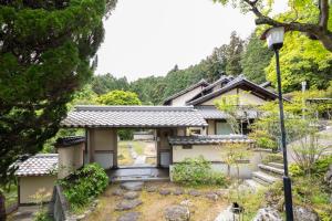 a house in the middle of a forest at Villa璃都りーと Villa Retreat in Ibaraki