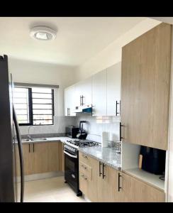 Η κουζίνα ή μικρή κουζίνα στο Residencial JT1 Avenida España
