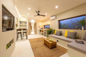 a living room with a couch and a table at 3min walk to the beach, night market, restaurant, Humble House 2 in Amphoe Koh Samui