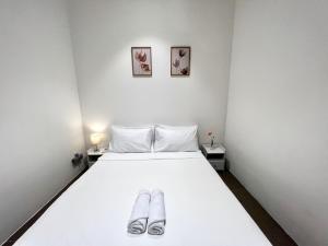 Postel nebo postele na pokoji v ubytování The EST Bangsar Kuala Lumpur