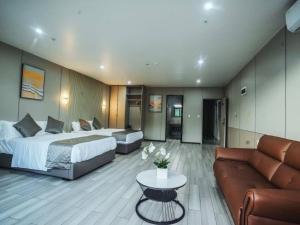 Postel nebo postele na pokoji v ubytování Taufusi Hotel