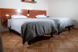 Postel nebo postele na pokoji v ubytování Hotel Solumbra