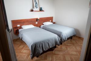 Postel nebo postele na pokoji v ubytování Hotel Solumbra