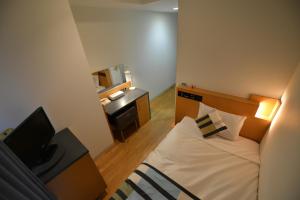 Tempat tidur dalam kamar di Hotel Flex