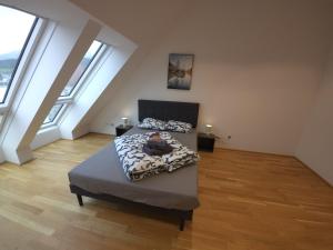 En eller flere senge i et værelse på Innsbruck Downtown Heaven Apartment