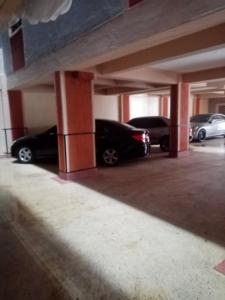 a group of cars parked in a parking garage at Mo Homes - Studio 2 in South B, 15mins from JKIA, Wilson Airport & Nairobi CBD in Nairobi