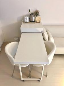 a white table and chairs in a room at Healing House in Seoul +83 photos