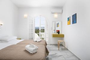 Postel nebo postele na pokoji v ubytování Grambella Sunset Spa Suite