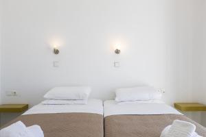 Postel nebo postele na pokoji v ubytování Grambella Sunset Spa Suite
