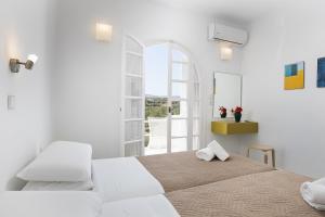 Postel nebo postele na pokoji v ubytování Grambella Sunset Spa Suite