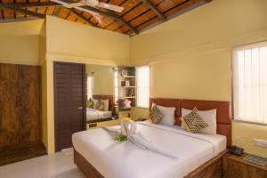 Katil atau katil-katil dalam bilik di Nirantara Resort & Spa