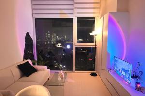 a living room with a white couch and a window at Healing House in Seoul