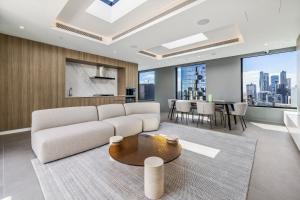 a living room with a couch and a table at Stunning Southbank 1 bed Free Parking in Melbourne