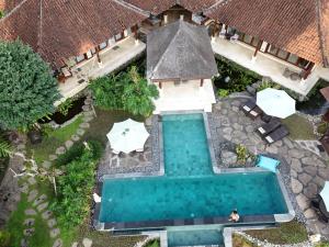 an overhead view of a swimming pool in a house at Heaven in Bali in Penginyahan