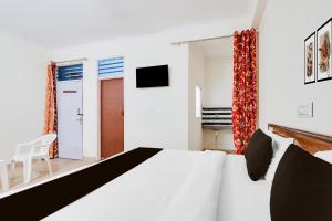 Postel nebo postele na pokoji v ubytování HOTEL O RAJ STAY
