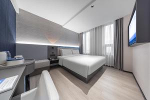 Postel nebo postele na pokoji v ubytování Atour Light Hotel Beijing West Station North Square