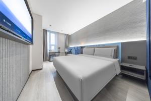 Postel nebo postele na pokoji v ubytování Atour Light Hotel Beijing West Station North Square