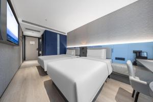 TV a/nebo společenská místnost v ubytování Atour Light Hotel Beijing West Station North Square