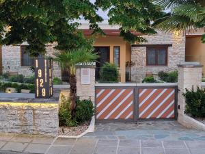 a house with a gate in front of it at 1929 Boutique Residences in Ioannina
