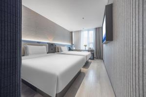 Postel nebo postele na pokoji v ubytování Atour Light Hotel Beijing West Station North Square