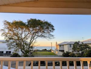 a view of the ocean from the balcony of a house at Beachside Chateau West Busselton in Busselton