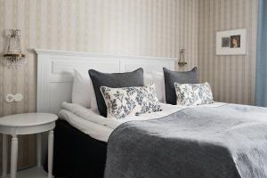 Postel nebo postele na pokoji v ubytování Boutique Hotel Yöpuu