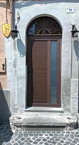 a door to a building with a window at La Casa di Grazia in Ronciglione