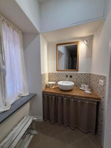 a bathroom with a sink and a mirror at HH Moneglia la Piazzetta in Moneglia +183 photos