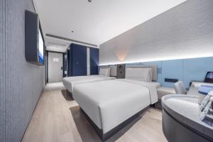 Postel nebo postele na pokoji v ubytování Atour Light Hotel Beijing West Station North Square