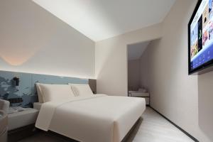 Voodi või voodid majutusasutuse Atour Light Hotel Hangzhou Sijiqing Nanxingqiao Metro Station toas