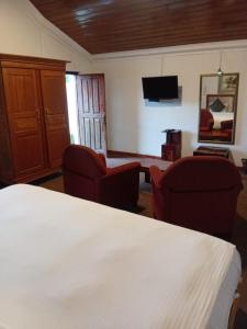 TV a/nebo společenská místnost v ubytování Tea Bush Hotel